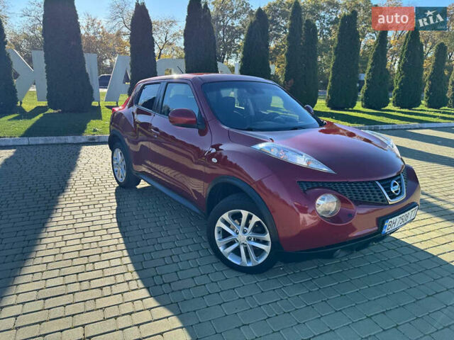 Красный Ниссан Жук, объемом двигателя 1.6 л и пробегом 169 тыс. км за 9800 $, фото 1 на Automoto.ua