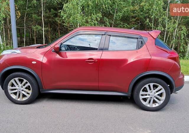 Червоний Ніссан Жук, об'ємом двигуна 1.6 л та пробігом 114 тис. км за 11000 $, фото 2 на Automoto.ua