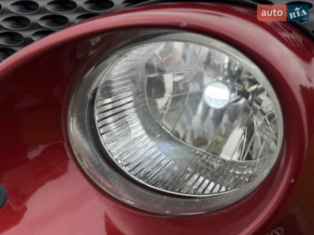 Червоний Ніссан Жук, об'ємом двигуна 1.6 л та пробігом 151 тис. км за 9900 $, фото 7 на Automoto.ua
