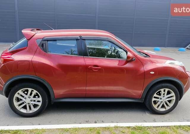 Червоний Ніссан Жук, об'ємом двигуна 1.6 л та пробігом 114 тис. км за 11000 $, фото 4 на Automoto.ua