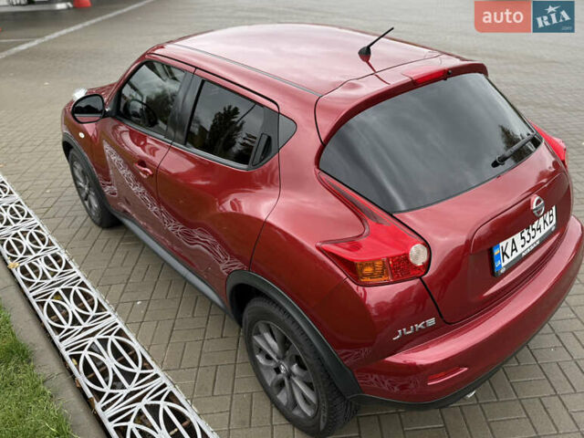 Червоний Ніссан Жук, об'ємом двигуна 1.6 л та пробігом 151 тис. км за 9900 $, фото 6 на Automoto.ua