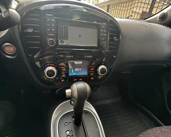 Червоний Ніссан Жук, об'ємом двигуна 1.6 л та пробігом 102 тис. км за 8950 $, фото 18 на Automoto.ua