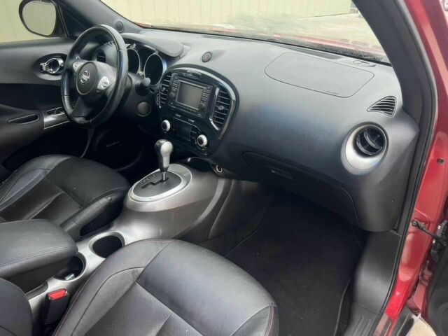 Червоний Ніссан Жук, об'ємом двигуна 1.6 л та пробігом 80 тис. км за 12600 $, фото 9 на Automoto.ua