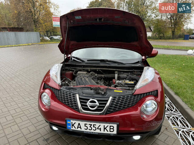 Червоний Ніссан Жук, об'ємом двигуна 1.6 л та пробігом 151 тис. км за 9900 $, фото 8 на Automoto.ua