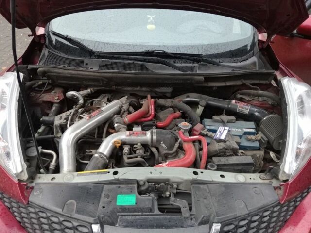 Красный Ниссан Жук, объемом двигателя 2 л и пробегом 126 тыс. км за 8900 $, фото 7 на Automoto.ua