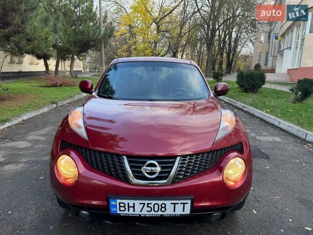 Красный Ниссан Жук, объемом двигателя 1.6 л и пробегом 170 тыс. км за 10300 $, фото 5 на Automoto.ua