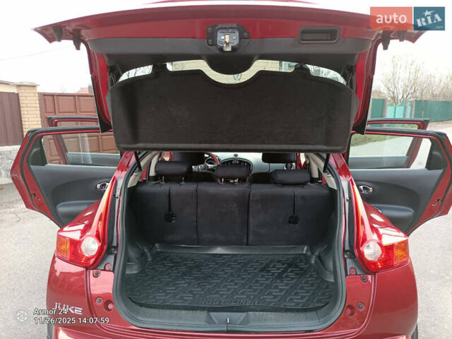Червоний Ніссан Жук, об'ємом двигуна 1.6 л та пробігом 66 тис. км за 11000 $, фото 7 на Automoto.ua