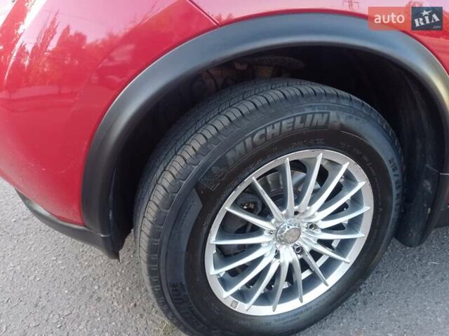 Красный Ниссан Жук, объемом двигателя 1.6 л и пробегом 150 тыс. км за 11200 $, фото 18 на Automoto.ua