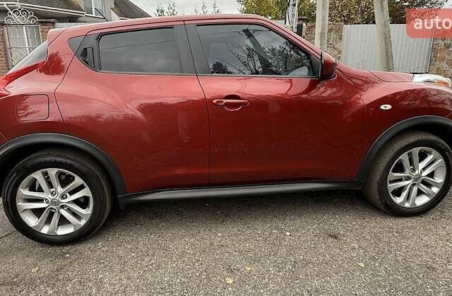 Красный Ниссан Жук, объемом двигателя 1.62 л и пробегом 209 тыс. км за 10500 $, фото 2 на Automoto.ua