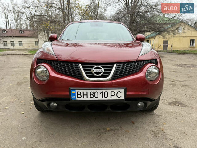 Красный Ниссан Жук, объемом двигателя 1.6 л и пробегом 130 тыс. км за 10500 $, фото 4 на Automoto.ua