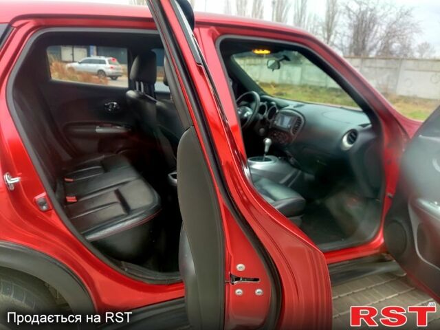 Червоний Ніссан Жук, об'ємом двигуна 1.6 л та пробігом 125 тис. км за 11950 $, фото 8 на Automoto.ua