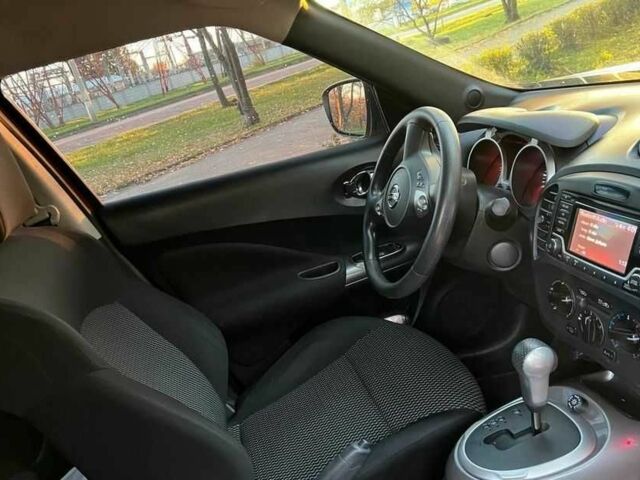 Красный Ниссан Жук, объемом двигателя 1.6 л и пробегом 90 тыс. км за 7200 $, фото 4 на Automoto.ua