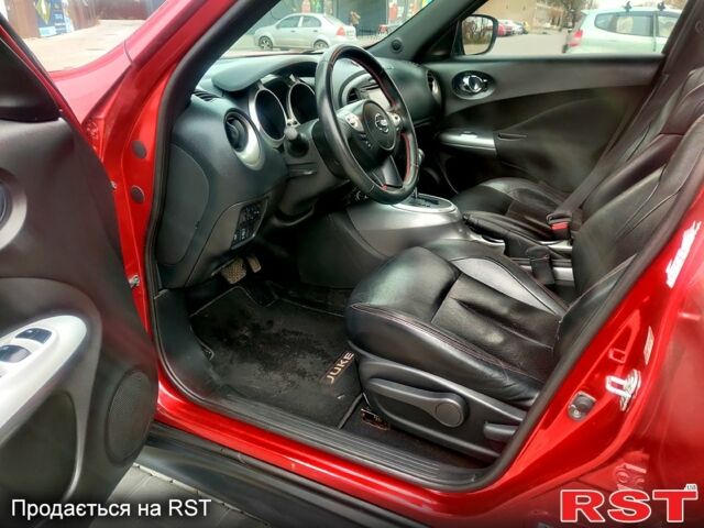 Червоний Ніссан Жук, об'ємом двигуна 1.6 л та пробігом 125 тис. км за 11950 $, фото 11 на Automoto.ua