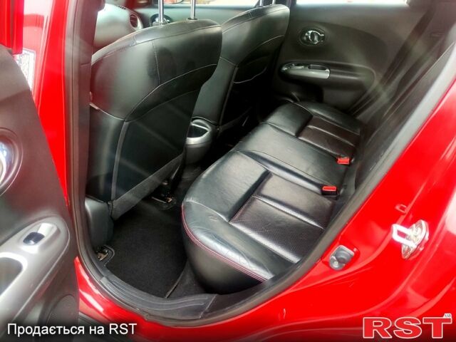 Червоний Ніссан Жук, об'ємом двигуна 1.6 л та пробігом 125 тис. км за 11950 $, фото 12 на Automoto.ua