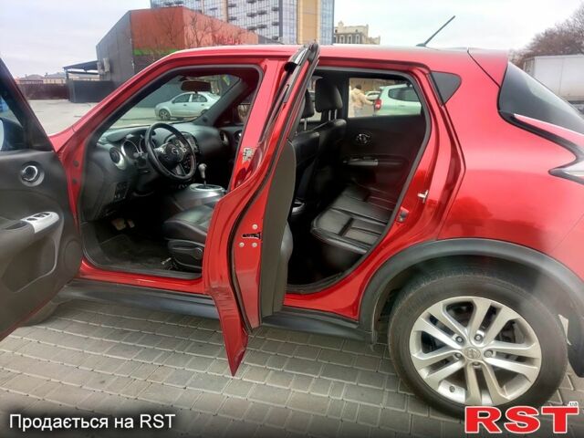 Червоний Ніссан Жук, об'ємом двигуна 1.6 л та пробігом 125 тис. км за 11950 $, фото 7 на Automoto.ua