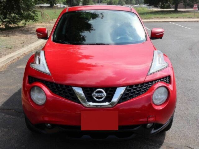 Красный Ниссан Жук, объемом двигателя 1.6 л и пробегом 72 тыс. км за 8000 $, фото 1 на Automoto.ua