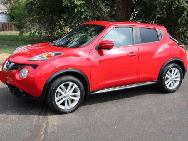 Красный Ниссан Жук, объемом двигателя 1.6 л и пробегом 72 тыс. км за 8000 $, фото 2 на Automoto.ua