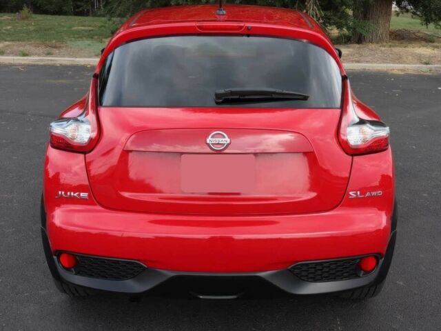 Красный Ниссан Жук, объемом двигателя 1.6 л и пробегом 72 тыс. км за 3500 $, фото 6 на Automoto.ua