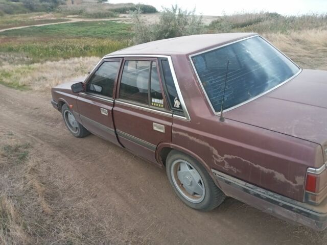 Красный Ниссан Лаурел, объемом двигателя 2.8 л и пробегом 500 тыс. км за 1300 $, фото 1 на Automoto.ua