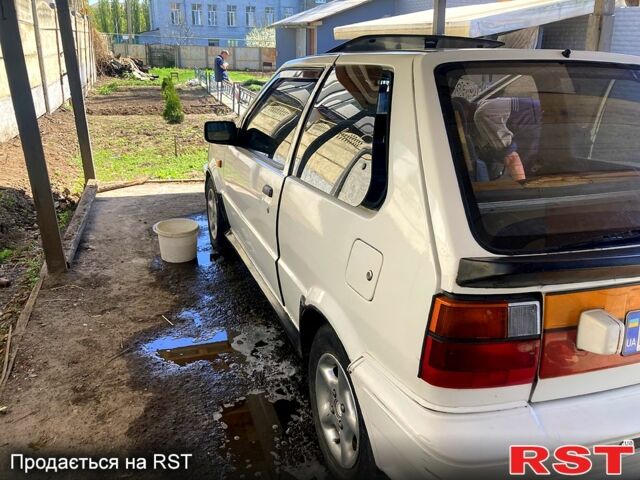 Белый Ниссан Марч, объемом двигателя 11 л и пробегом 298 тыс. км за 1400 $, фото 1 на Automoto.ua