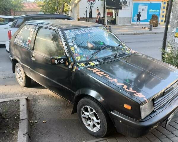 Черный Ниссан Марч, объемом двигателя 1 л и пробегом 200 тыс. км за 500 $, фото 4 на Automoto.ua