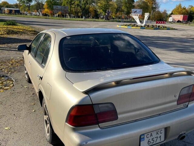 Бежевый Ниссан Максима, объемом двигателя 3 л и пробегом 400 тыс. км за 1900 $, фото 2 на Automoto.ua