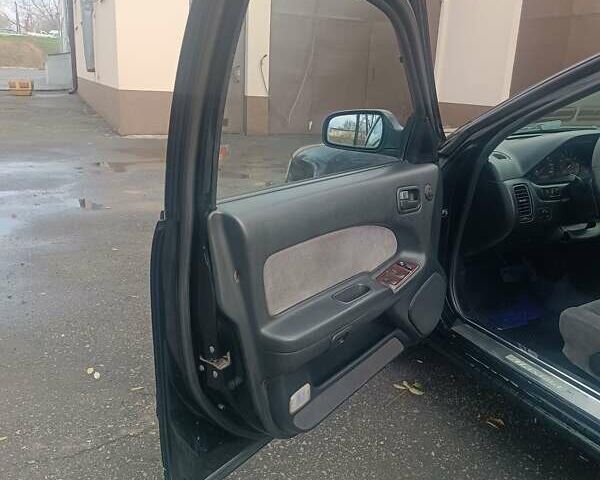 Черный Ниссан Максима, объемом двигателя 2 л и пробегом 291 тыс. км за 2850 $, фото 8 на Automoto.ua