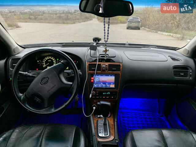 Черный Ниссан Максима, объемом двигателя 2 л и пробегом 258 тыс. км за 4500 $, фото 10 на Automoto.ua