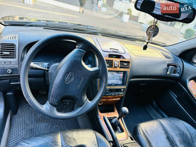 Черный Ниссан Максима, объемом двигателя 2 л и пробегом 197 тыс. км за 5400 $, фото 18 на Automoto.ua