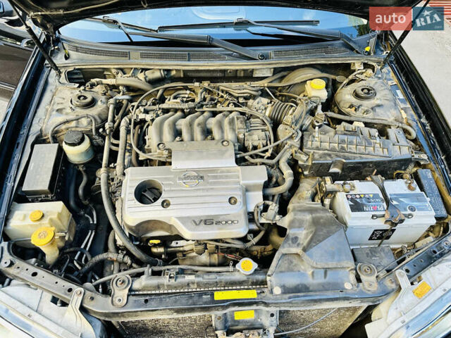 Черный Ниссан Максима, объемом двигателя 2 л и пробегом 197 тыс. км за 5400 $, фото 45 на Automoto.ua