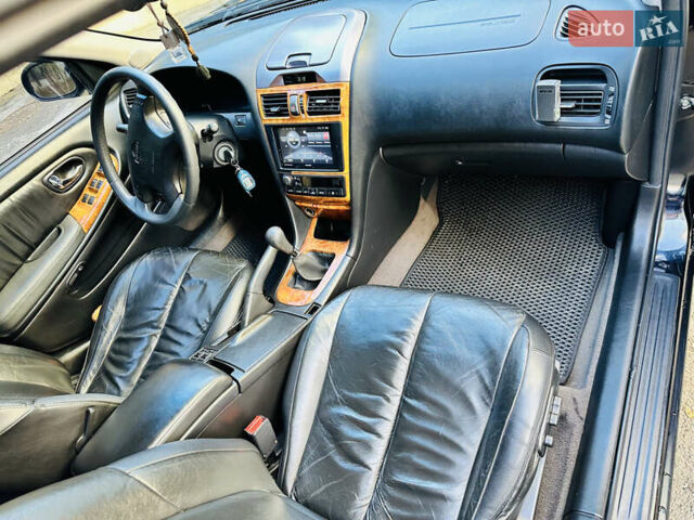 Черный Ниссан Максима, объемом двигателя 2 л и пробегом 197 тыс. км за 5400 $, фото 27 на Automoto.ua