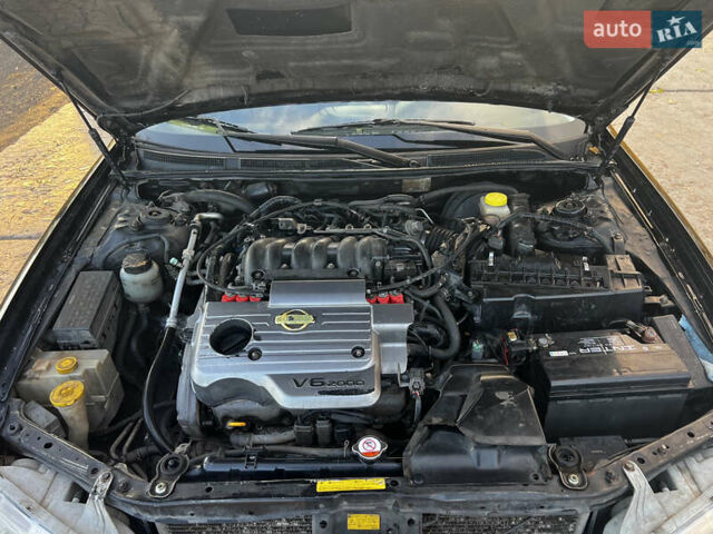 Черный Ниссан Максима, объемом двигателя 2 л и пробегом 300 тыс. км за 3300 $, фото 11 на Automoto.ua