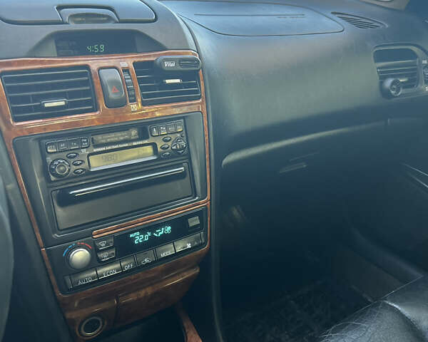 Черный Ниссан Максима, объемом двигателя 2 л и пробегом 300 тыс. км за 3300 $, фото 25 на Automoto.ua