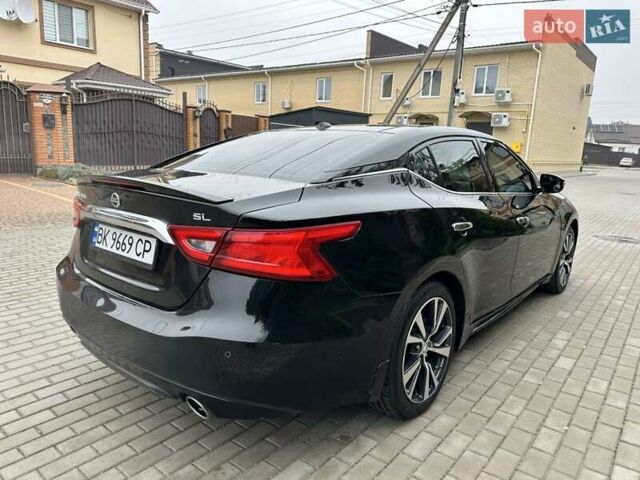 Черный Ниссан Максима, объемом двигателя 3.5 л и пробегом 107 тыс. км за 16900 $, фото 1 на Automoto.ua