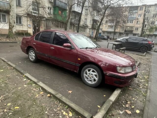 Червоний Ніссан Максіма, об'ємом двигуна 3 л та пробігом 378 тис. км за 1650 $, фото 6 на Automoto.ua