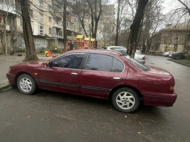 Червоний Ніссан Максіма, об'ємом двигуна 3 л та пробігом 378 тис. км за 1650 $, фото 2 на Automoto.ua