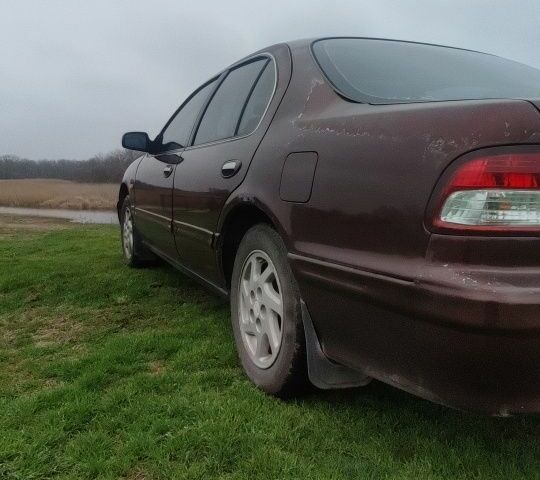 Червоний Ніссан Максіма, об'ємом двигуна 2 л та пробігом 390 тис. км за 2500 $, фото 2 на Automoto.ua