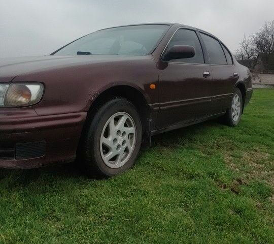 Червоний Ніссан Максіма, об'ємом двигуна 2 л та пробігом 390 тис. км за 2500 $, фото 1 на Automoto.ua