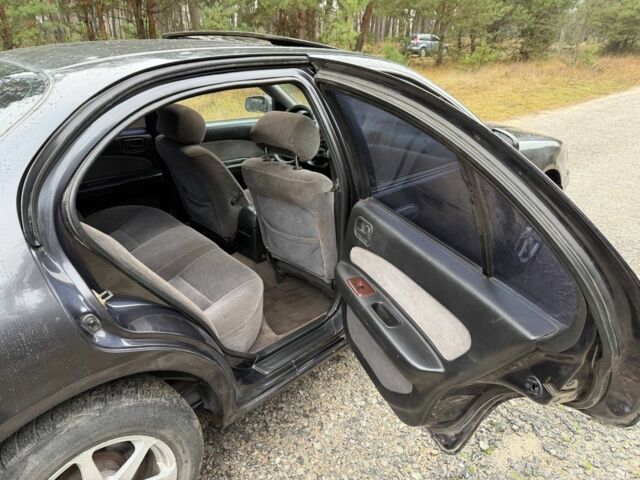 Сірий Ніссан Максіма, об'ємом двигуна 2 л та пробігом 275 тис. км за 2450 $, фото 9 на Automoto.ua