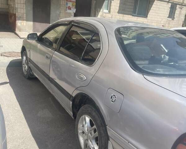 Серый Ниссан Максима, объемом двигателя 2 л и пробегом 280 тыс. км за 1250 $, фото 2 на Automoto.ua