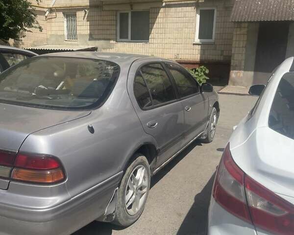 Серый Ниссан Максима, объемом двигателя 2 л и пробегом 280 тыс. км за 1250 $, фото 3 на Automoto.ua