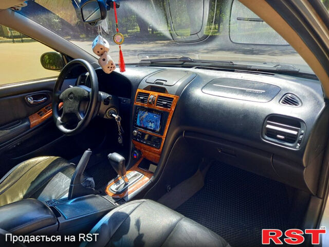 Сірий Ніссан Максіма, об'ємом двигуна 2 л та пробігом 270 тис. км за 3800 $, фото 2 на Automoto.ua