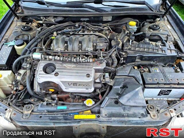 Синий Ниссан Максима, объемом двигателя 2 л и пробегом 280 тыс. км за 2100 $, фото 7 на Automoto.ua