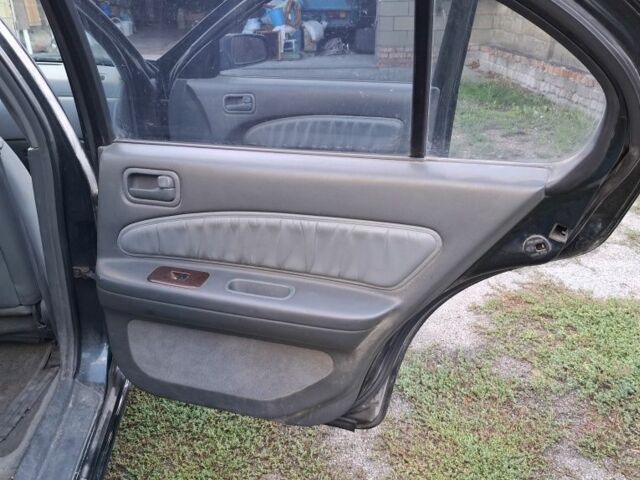 Зелений Ніссан Максіма, об'ємом двигуна 2 л та пробігом 290 тис. км за 1024 $, фото 22 на Automoto.ua