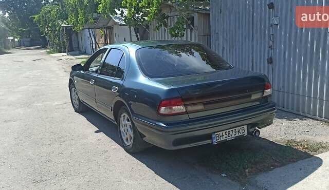 Зеленый Ниссан Максима, объемом двигателя 2 л и пробегом 234 тыс. км за 3500 $, фото 1 на Automoto.ua