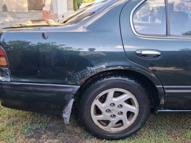 Зелений Ніссан Максіма, об'ємом двигуна 2 л та пробігом 290 тис. км за 1024 $, фото 5 на Automoto.ua