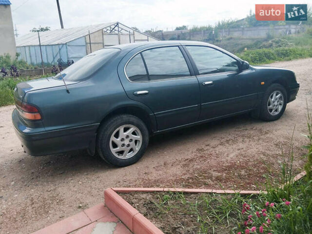 Зелений Ніссан Максіма, об'ємом двигуна 3 л та пробігом 350 тис. км за 3200 $, фото 4 на Automoto.ua