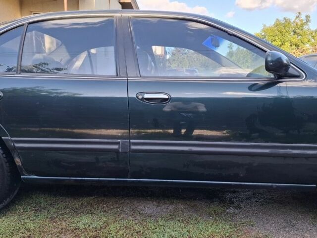 Зелений Ніссан Максіма, об'ємом двигуна 2 л та пробігом 290 тис. км за 1024 $, фото 6 на Automoto.ua