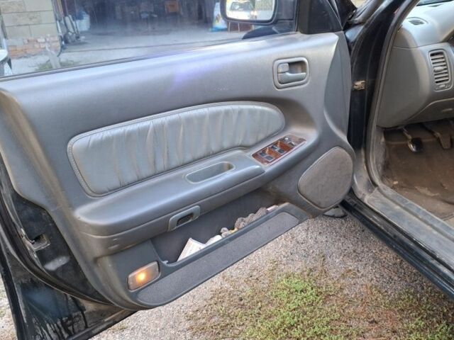 Зелений Ніссан Максіма, об'ємом двигуна 2 л та пробігом 290 тис. км за 1024 $, фото 16 на Automoto.ua