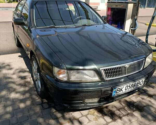 Зелений Ніссан Максіма, об'ємом двигуна 2.99 л та пробігом 435 тис. км за 2999 $, фото 10 на Automoto.ua
